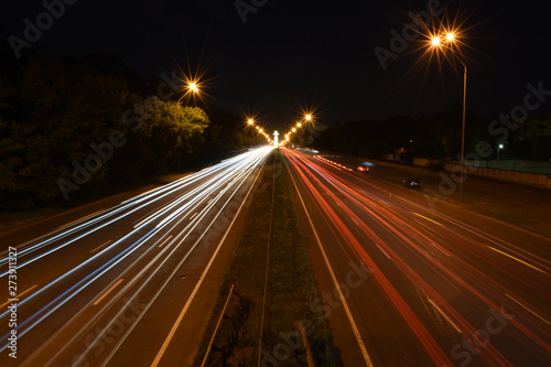 Evening traffic streaks by on a highway