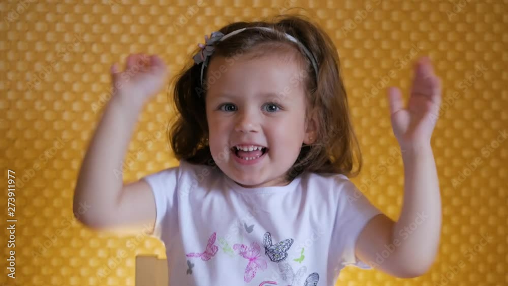 Beautiful funny happy child is playing and waving his hands. Beautiful funny happy child is playing and waving his hands.