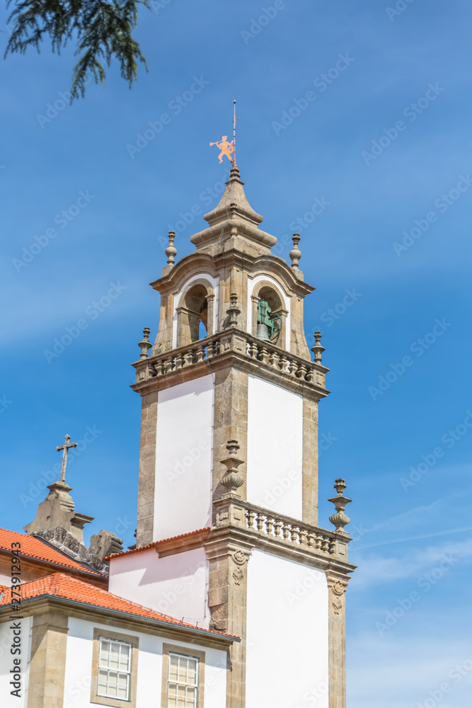 Viseu / Portugal - 04 16 2019 : View of a tower at the Church of Mercy, baroque style monument, architectural icon of the city of Viseu, in Portugal