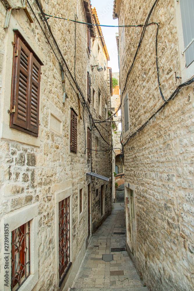 Narrow street and old houses in the old town in Split, Croatia