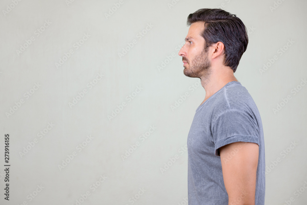 Studio shot profile view of handsome bearded man Studio shot profile view of handsome bearded man