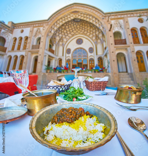 Plum and spinach stew in restaurant of Kashan, Iran photo