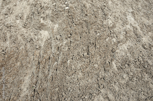 Large pile of construction sand close up as texture and background © Aleksei