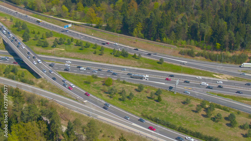 AERIAL: Countless vehicles drive up and down the busy highway network in summer.