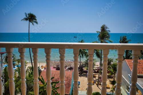 Phu Quoc island  Vietnam - March 31  2019  Balcony railing at the hotel  view of the sea and the beach. Growing palm trees on the coast recreation area