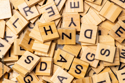Heap of scrabble tile letters from above