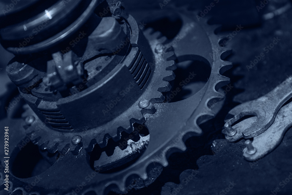 Detail of machine with gears is assembled film crew. Toned photo blue Detail of machine with gears is assembled film crew. Toned photo blue