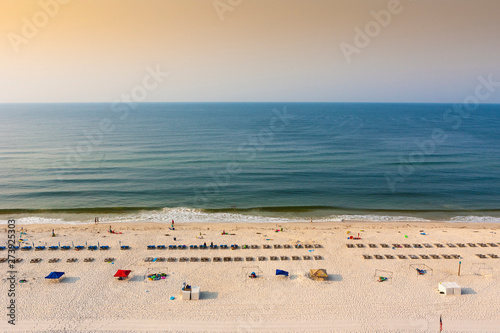A beach in Gulf shores alabama from above at sunrise in early summer