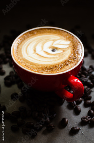 hot latte art in red mug