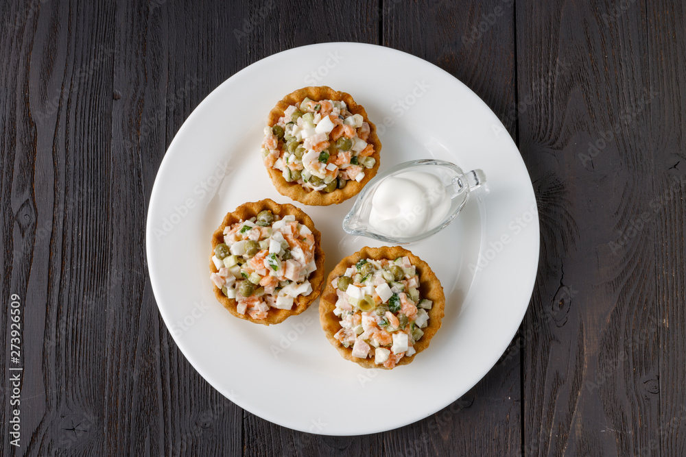 Traditional russian salad Olivier in tartlet Traditional russian salad Olivier in tartlet