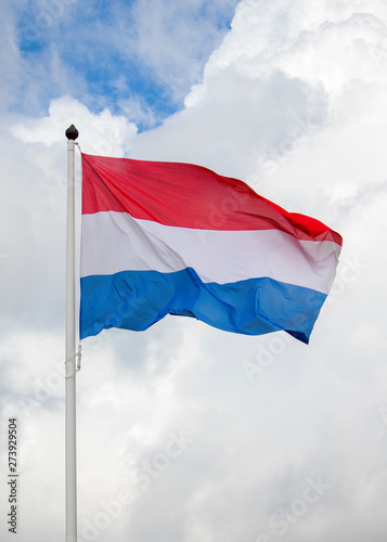 flying Dutch flag, red white and blue, hoisted flag