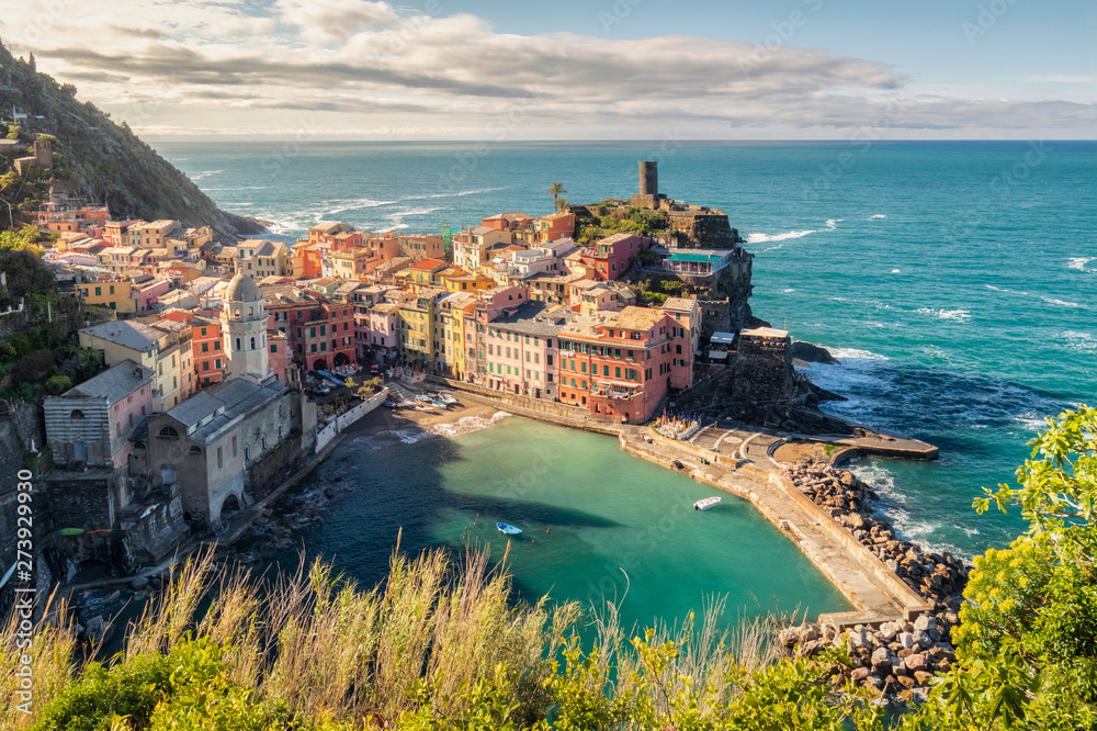 View of the beautiful sunrise seaside of Vernazza village in summer in the Cinque Terre area