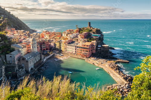 View of the beautiful sunrise seaside of Vernazza village in summer in the Cinque Terre area