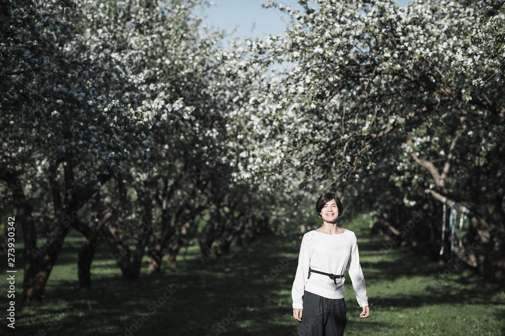 Portrait of fashionable woman at blossoming season Portrait of fashionable woman at blossoming season