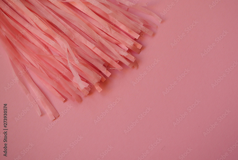 pink paper bundle on a pink background. pink paper bundle on a pink background.