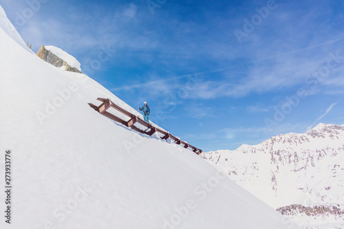 Austria, Tyrol, Galtuer, skier standing above an avalanche protection photo