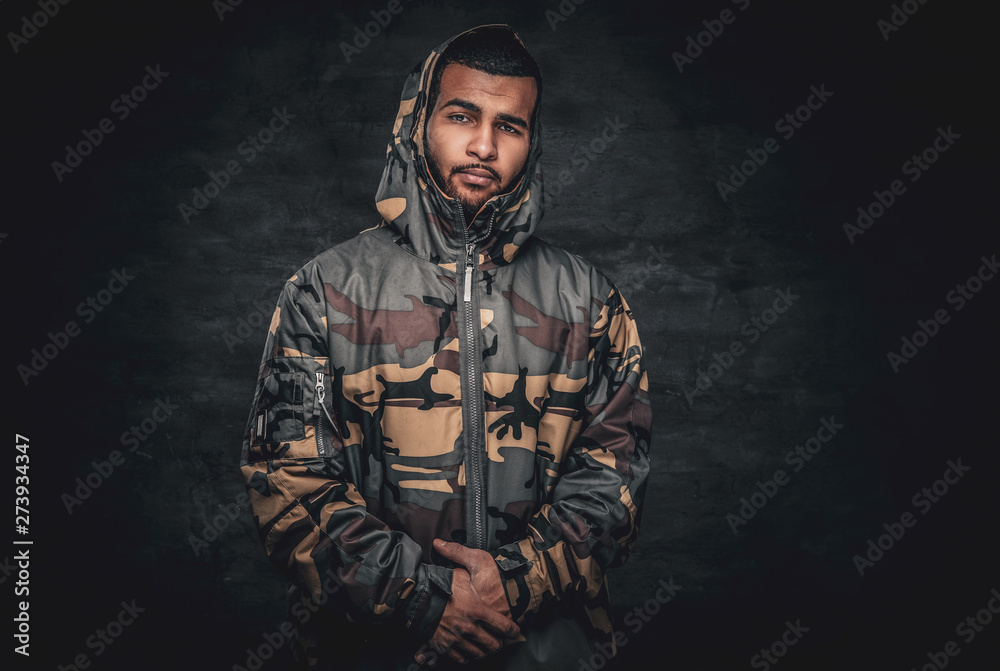 Black male dressed in a military jacket. Black male dressed in a military jacket.