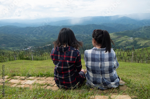 Friendship between friends. Two women sitting at the view