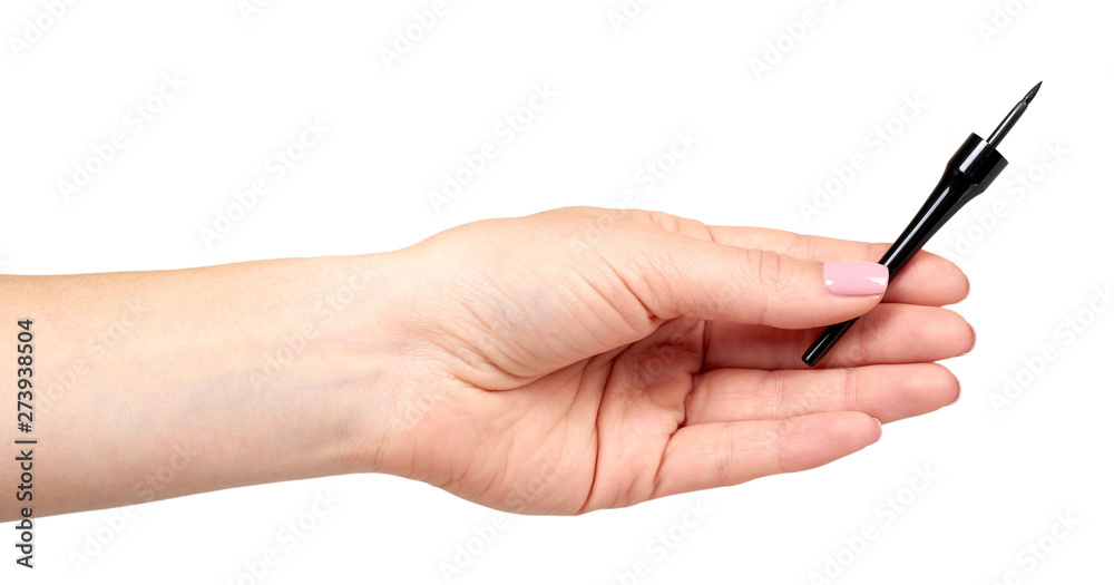 Hand with black liquid pencil, eye makeup brush. Hand with black liquid pencil, eye makeup brush.