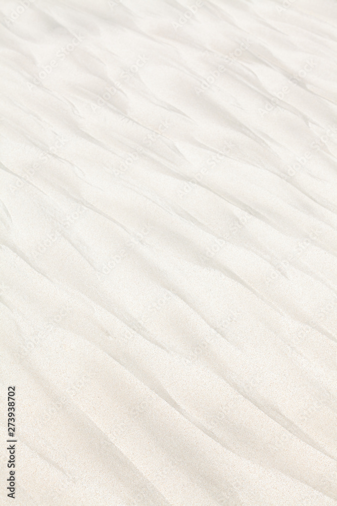 Dark patterns on the white beach sand Dark patterns on the white beach sand