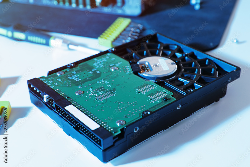 Hard drive on table. Computer repair service Hard drive on table. Computer repair service