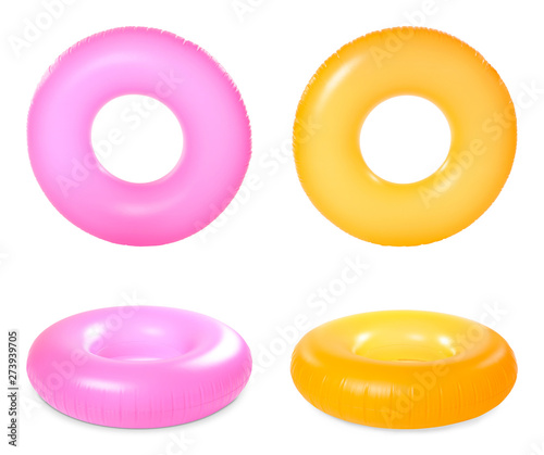Set of bright inflatable rings on white background photo