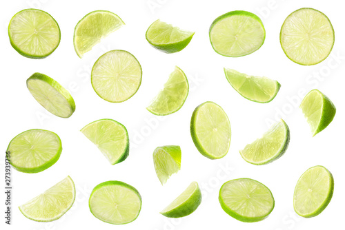 Set of flying cut fresh juicy lime on white background photo