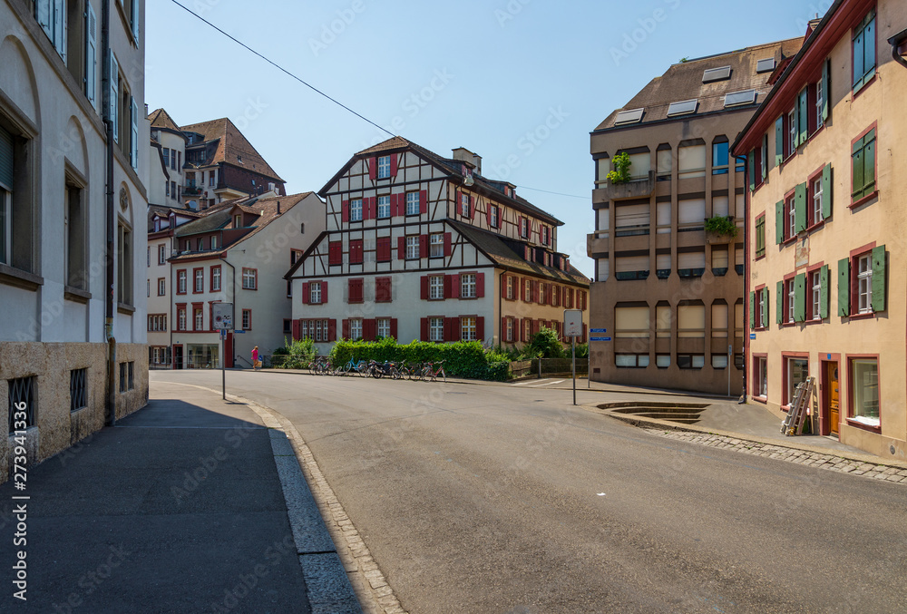 Outdoor sunny street view of empty cityscape with typical building style, mixture between modern architecture and ancient wooden house, in Europe around Germany, Austria and Switzerland. 