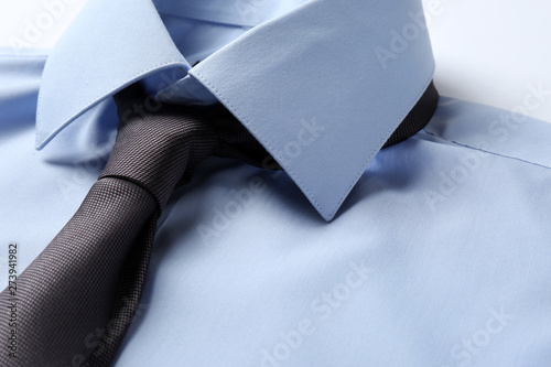 Canvas Print Color male necktie on blue shirt, closeup. Space for text