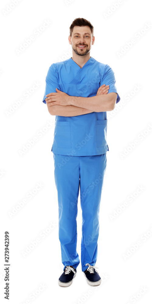 Full length portrait of smiling male doctor in scrubs isolated on white. Medical staff Full length portrait of smiling male doctor in scrubs isolated on white. Medical staff