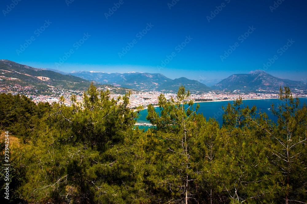 Beautiful view of the Mediterranean Sea, the mountains, the forest and the city. Turkey, Alanya.