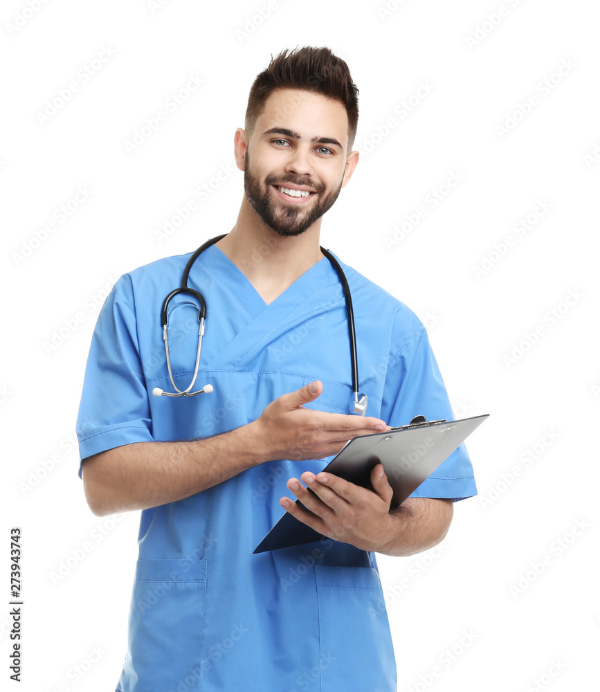 Young male doctor in uniform with clipboard isolated on white Young male doctor in uniform with clipboard isolated on white