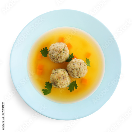 Dish of Jewish matzoh balls soup isolated on white, top view photo