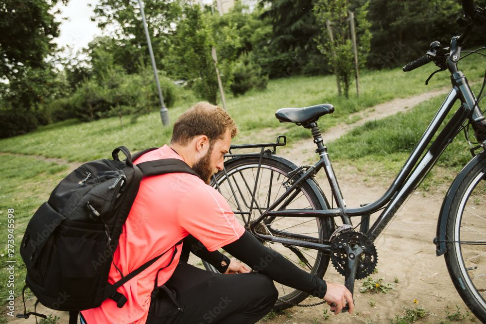 Handsome man and his bicycle in nature. Healthy life Handsome man and his bicycle in nature. Healthy life