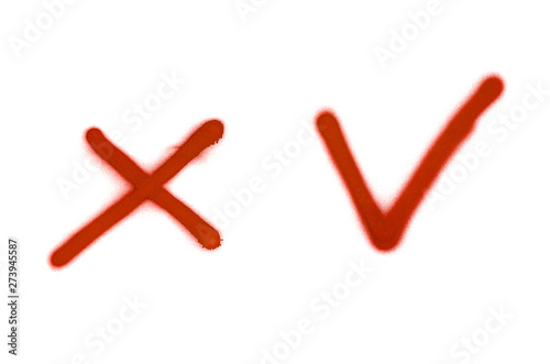 Graffiti check mark and cross sign sprayed on white isolated background
