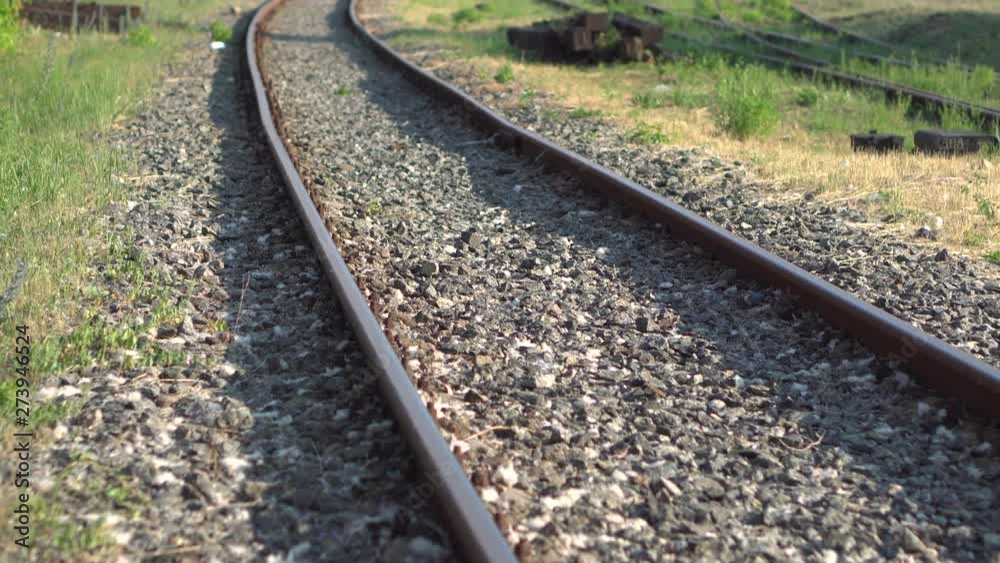 Railway rails and sleepers in summer sunny day. Close-up. Railroad track Railway rails and sleepers in summer sunny day. Close-up. Railroad track