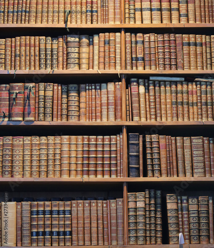 old books on wooden shelf