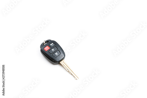 A Toyota car key is isolated on a white background on a downward slanted angle.
