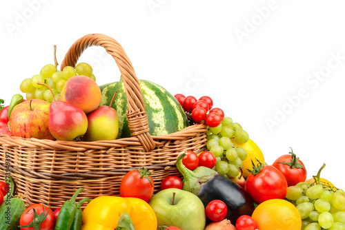 Fototapeta Naklejka Na Ścianę i Meble -  Large variety useful fruits and vegetables in basket isolated on white