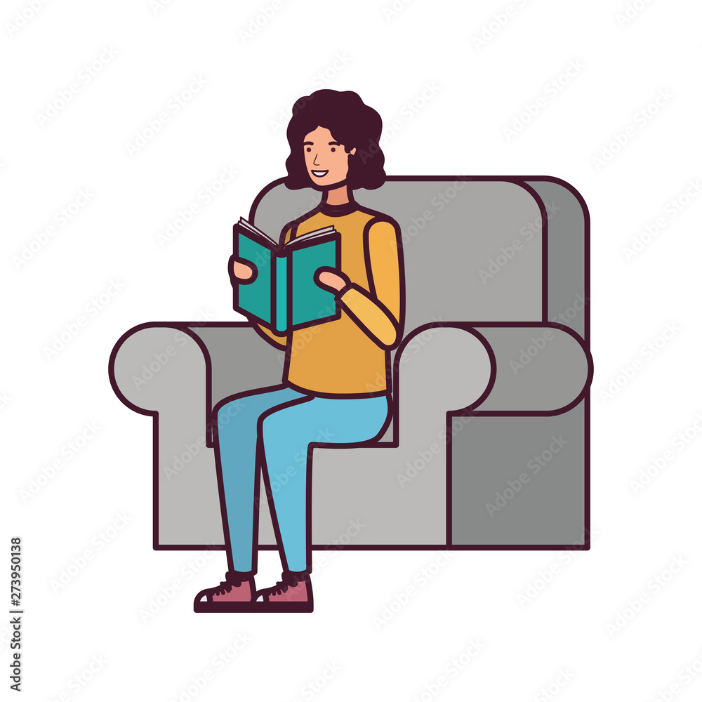 man sitting on chair with book in hands