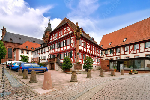Church Saint Gangolf and marian column at town square in old town, Lower Franconia (Unterfranken) in Bavaria, Germany