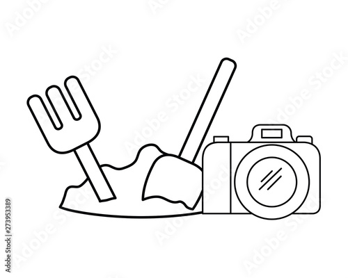 silhouette of shovel and rake and camera photographic