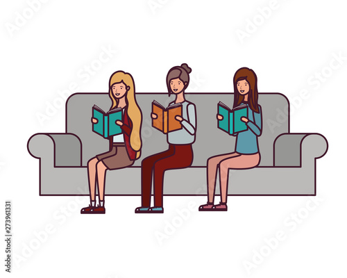 women sitting on chair with book in hands