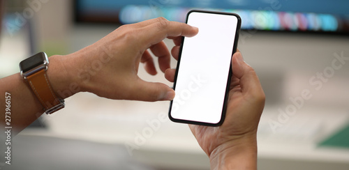 Man sitting and holding isolate white screen mobile smartphone in hand