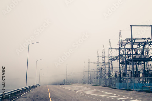 Power plant - transformation station. Multitude of cables and wires photo