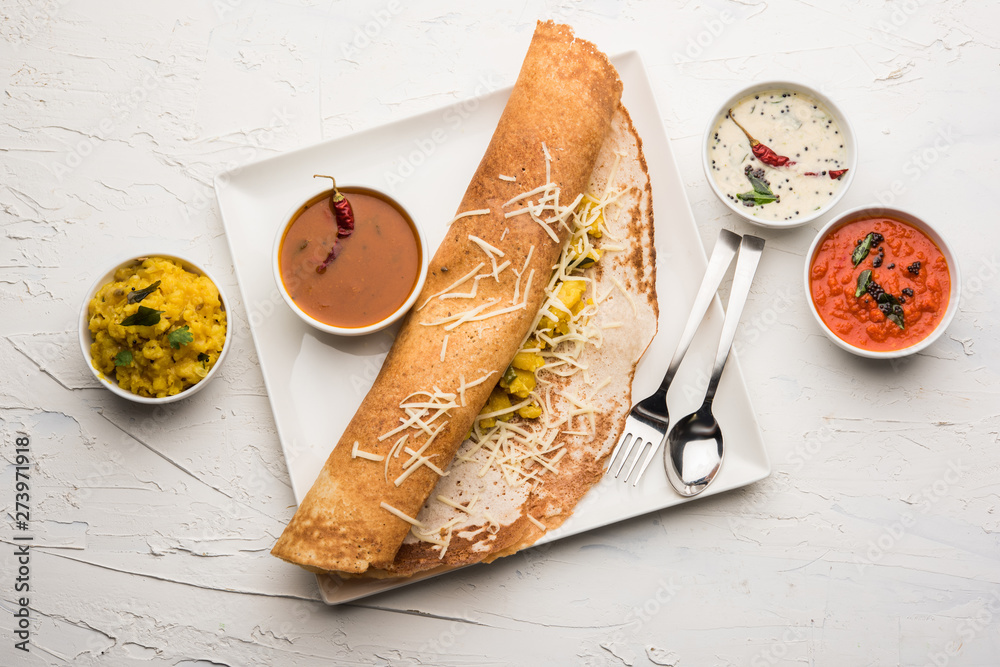cheese masala dosa recipe with sambar and chutney, selective focus