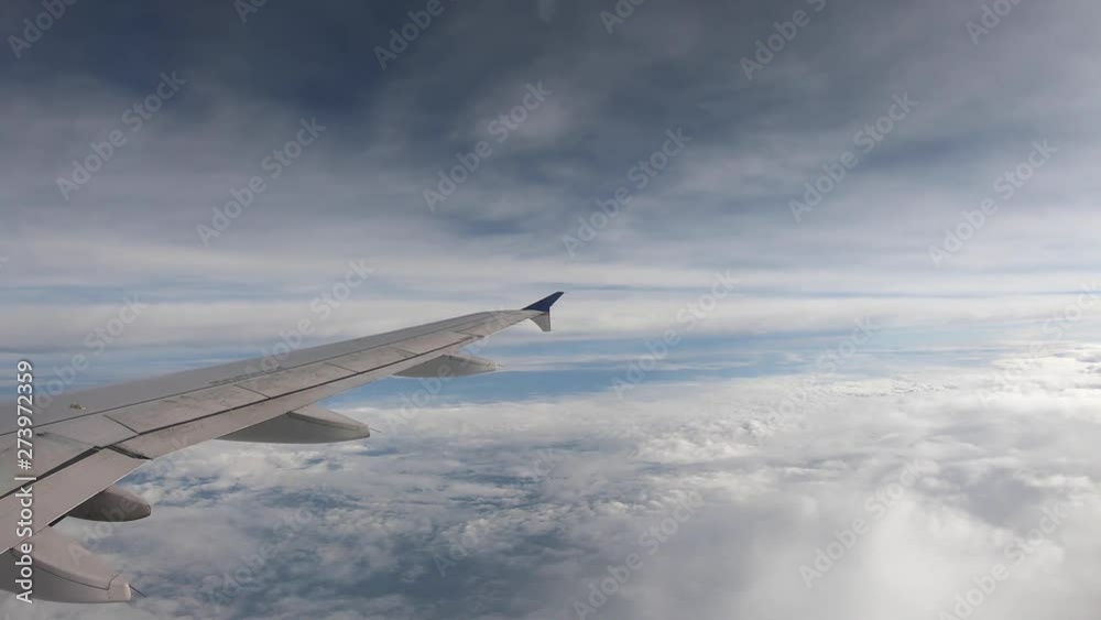 Time lapse of an airplane mid flight above the clouds Time lapse of an airplane mid flight above the clouds