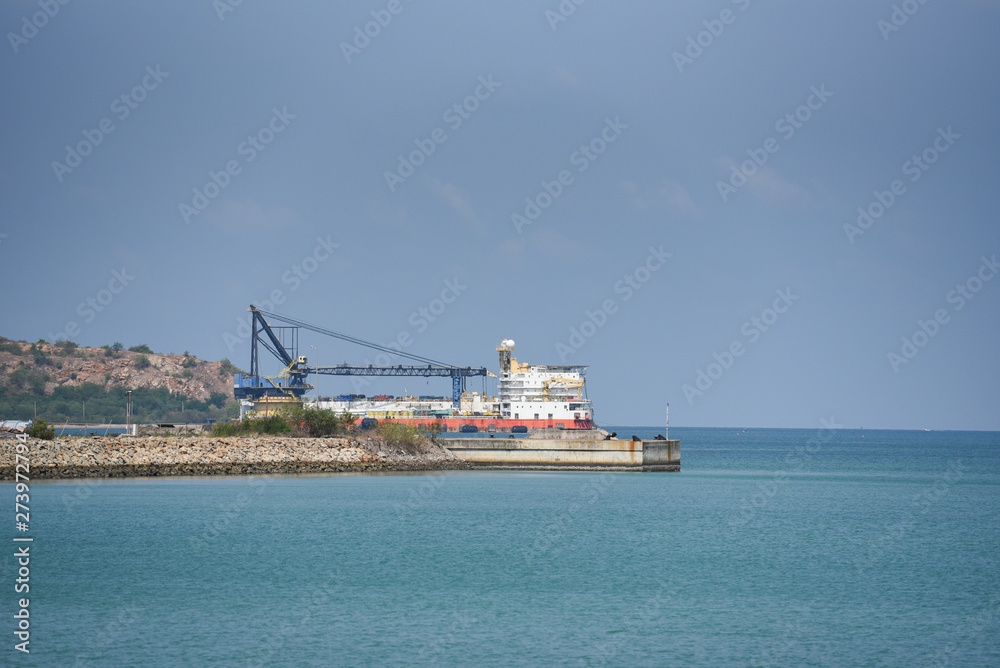 Crane Construction port for container ship in export and import business and logistics in harbor industry coast
