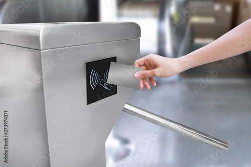 Woman use card for touch of entrance gate card access Security system.
