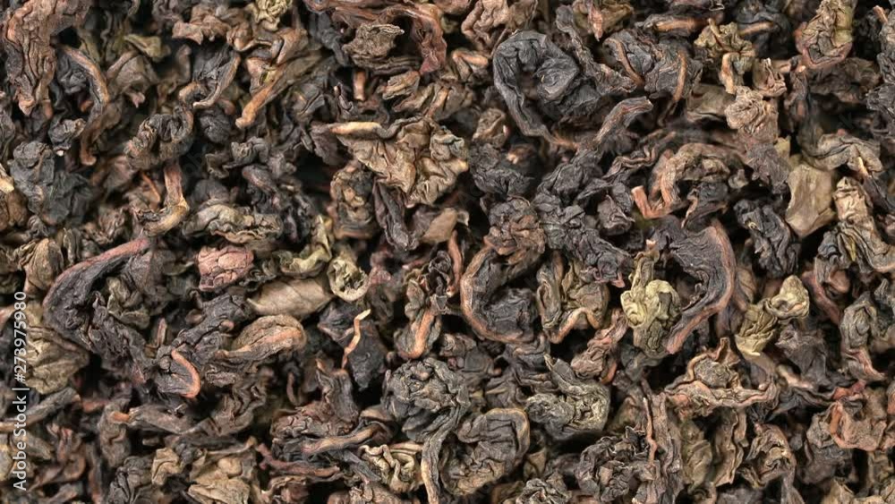 rolled leaves of oolong tea background - overhead view on turntable rolled leaves of oolong tea background - overhead view on turntable